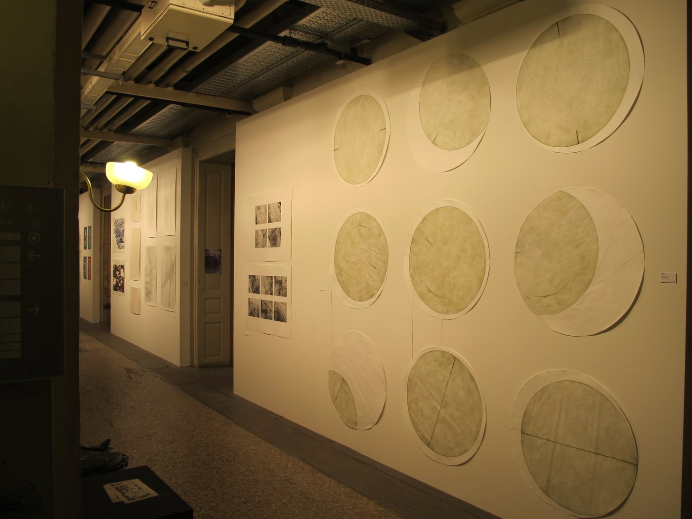 Paper works on a wall in the corridor