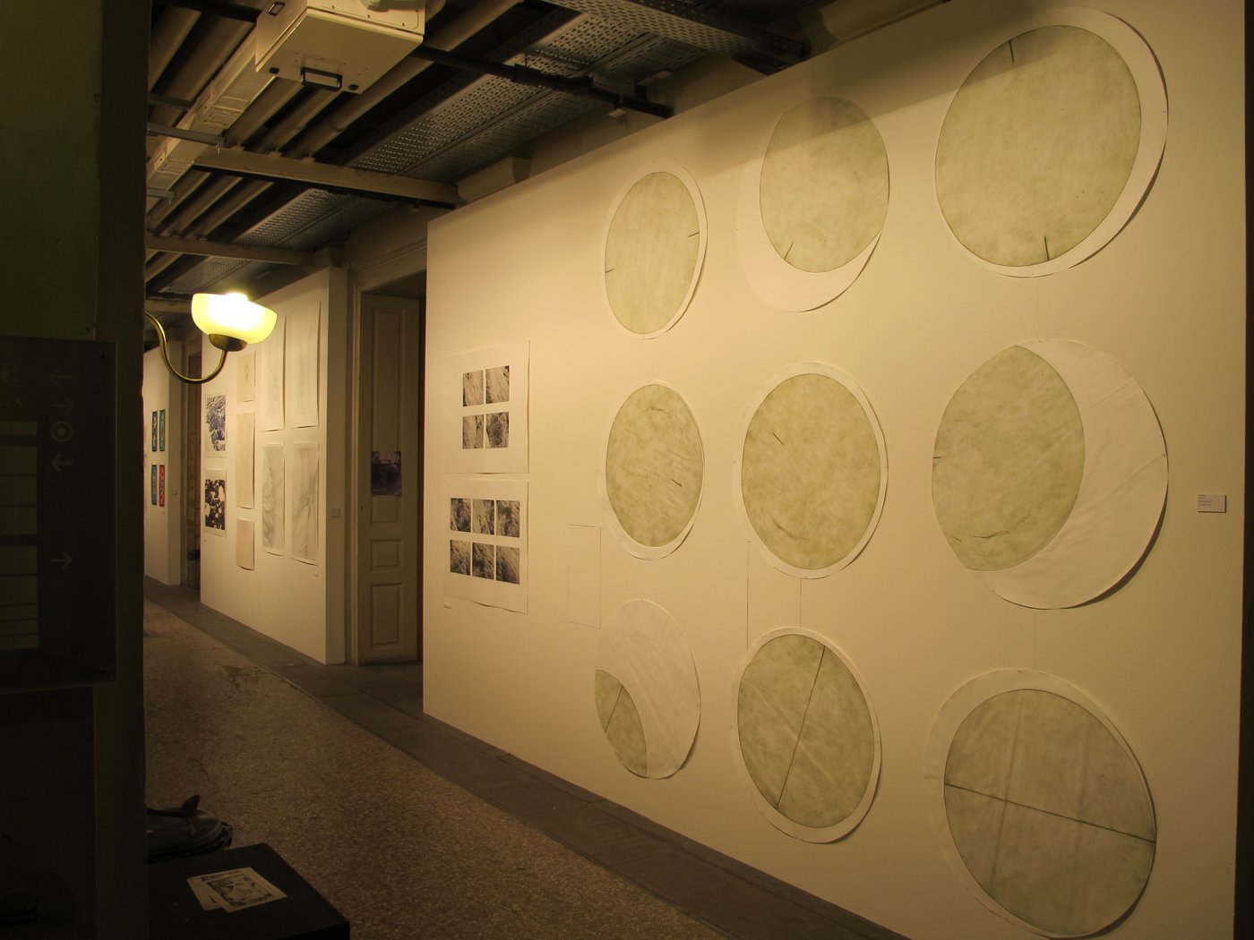1 Paper works on a wall in the corridor