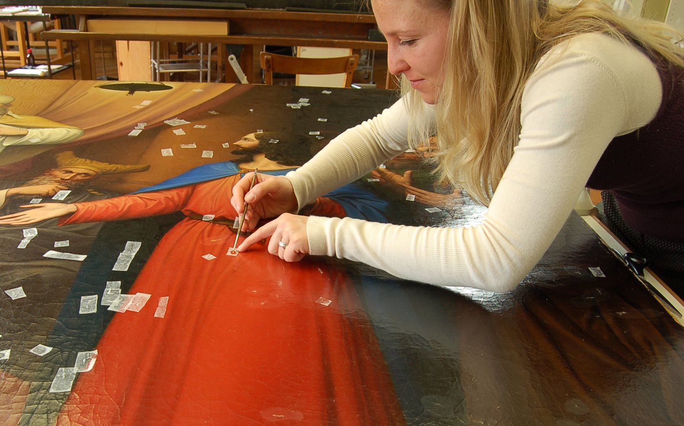 Student working on a canvas