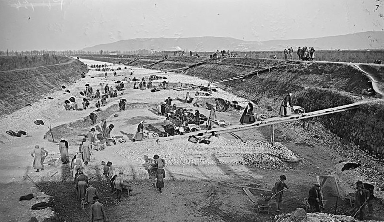 
    Italian women workers collecting stones from the river bed for road construction.
   
