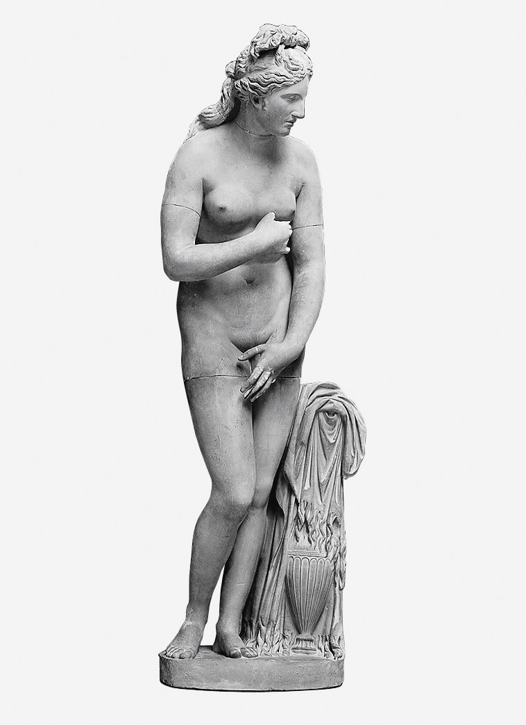 The black-and-white photograph shows a cast of a marble sculpture of the Capitoline Venus, a nude young woman in front of a light-coloured background.