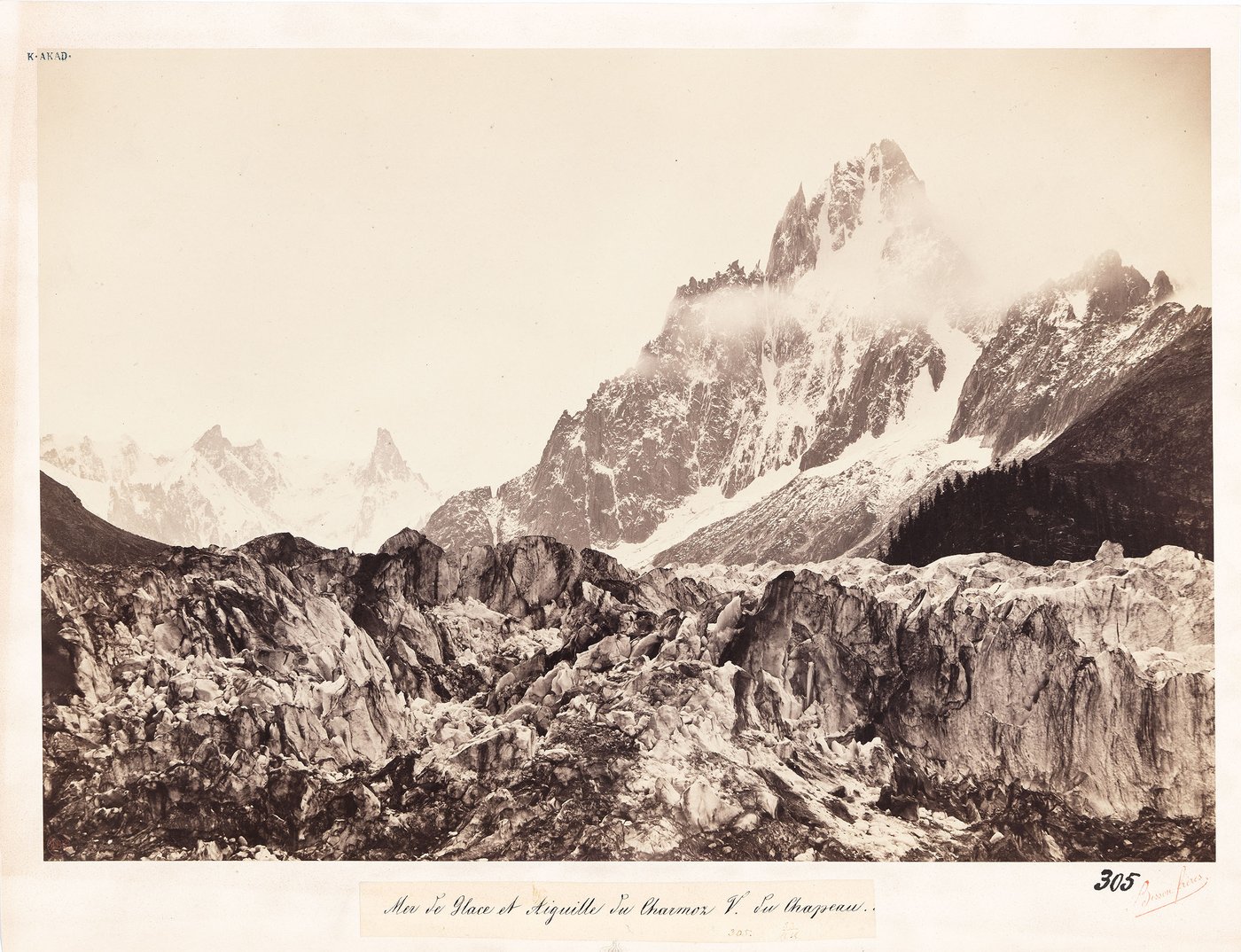 Black and white photograph of a glacier and partly snow-covered mountain range in the French Alps.