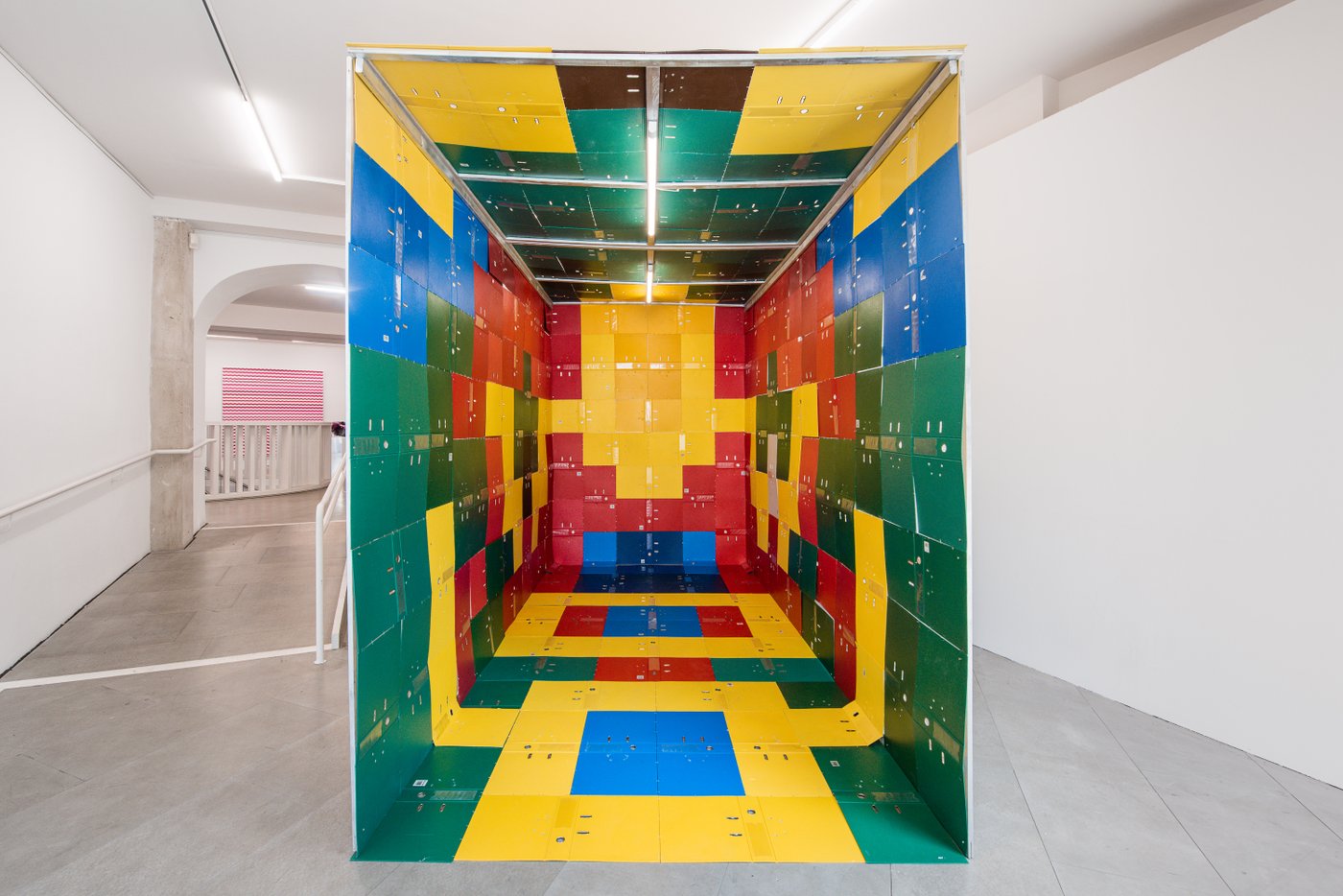 a constructed space of colorful folders unfolded and strung together