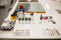 Materials and tools prepared for conservation treatment of a painting. Photo © Robert Vanis