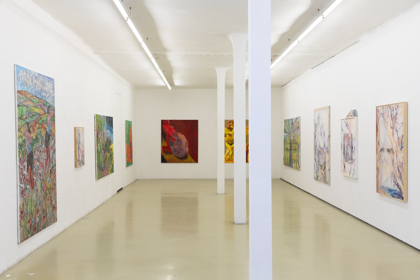 exhibition view with paintings