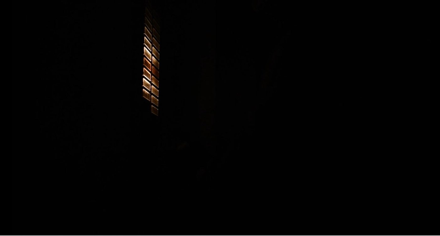 First documentary practice by Konrad Behr. Color, 8 min Light shines through glass tiles into a black room