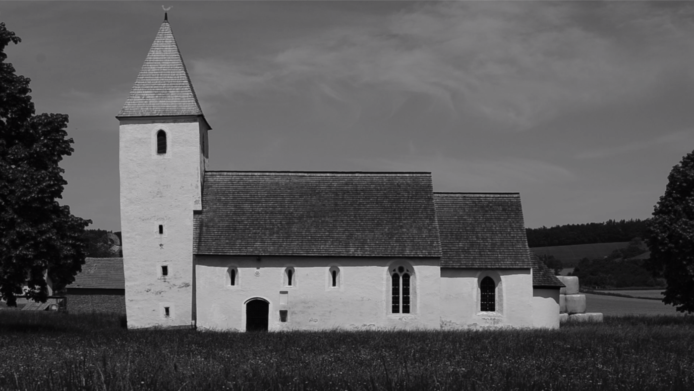 Excerpts from Kirchstetten by Kyra Kaisla. B/W, 10 min black and white photo of a rural church, around field and forest