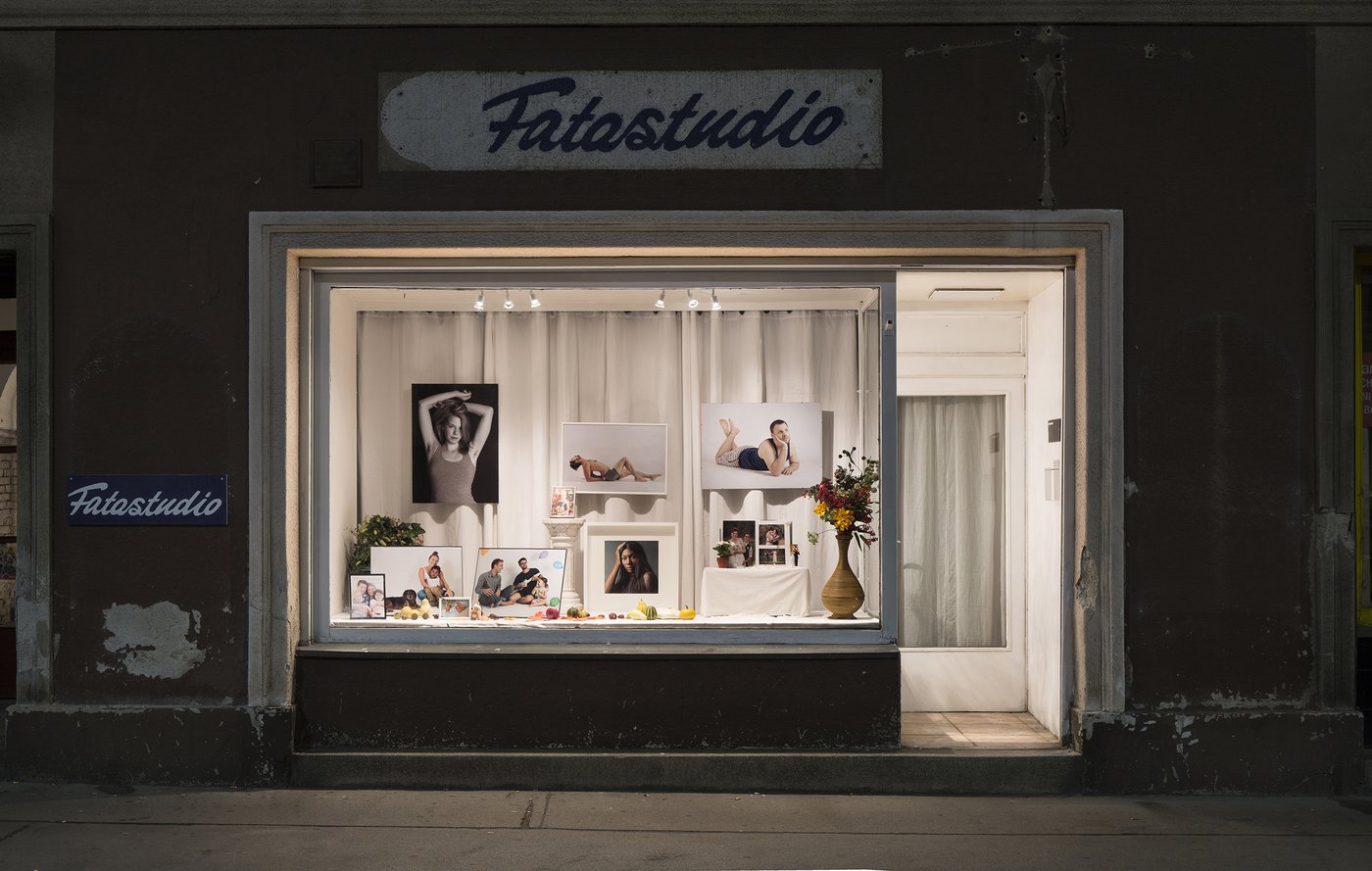The photo shows the window of a photographers studio.
