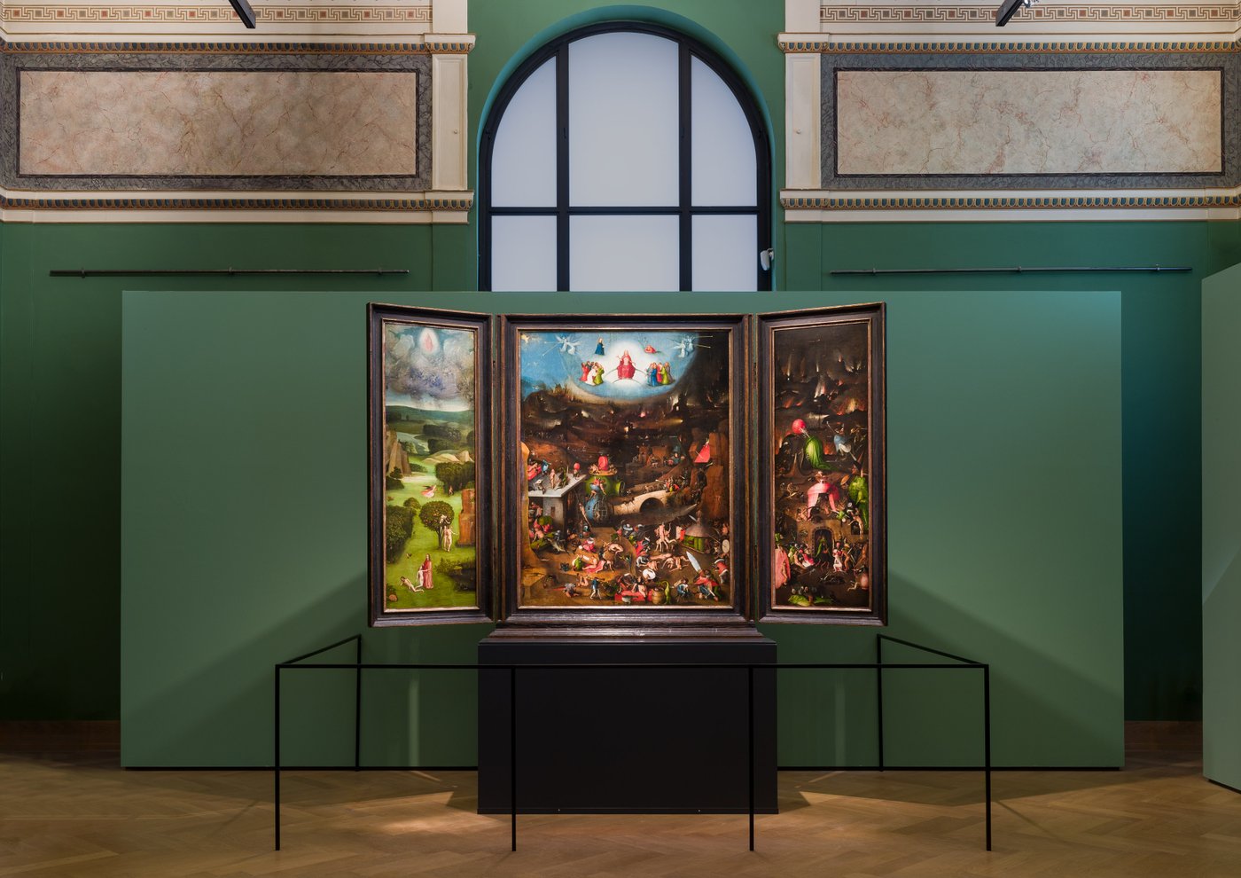 an oil painting is presented in an exhibition space