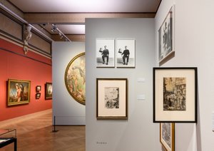 exhibition rooms with many paintings on the wall