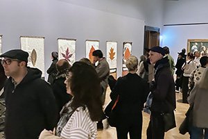 people in an exhibition room