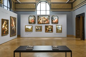 exhibition view of historical paintings in a historical museum