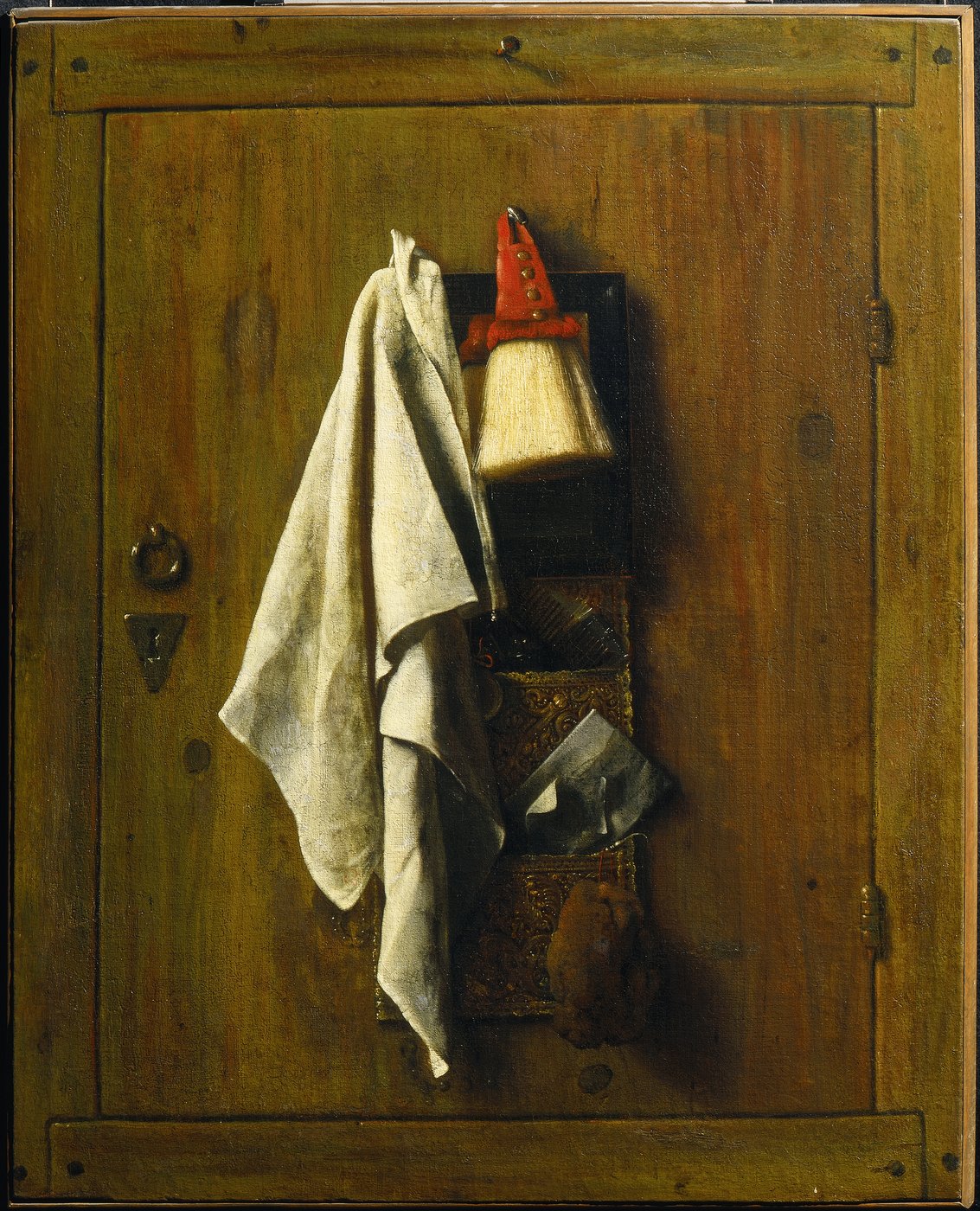 Painting of a wooden door on which hangs a toilet bag with comb, beard brush, sponge and other utensils, next to it hangs a white cloth towel.