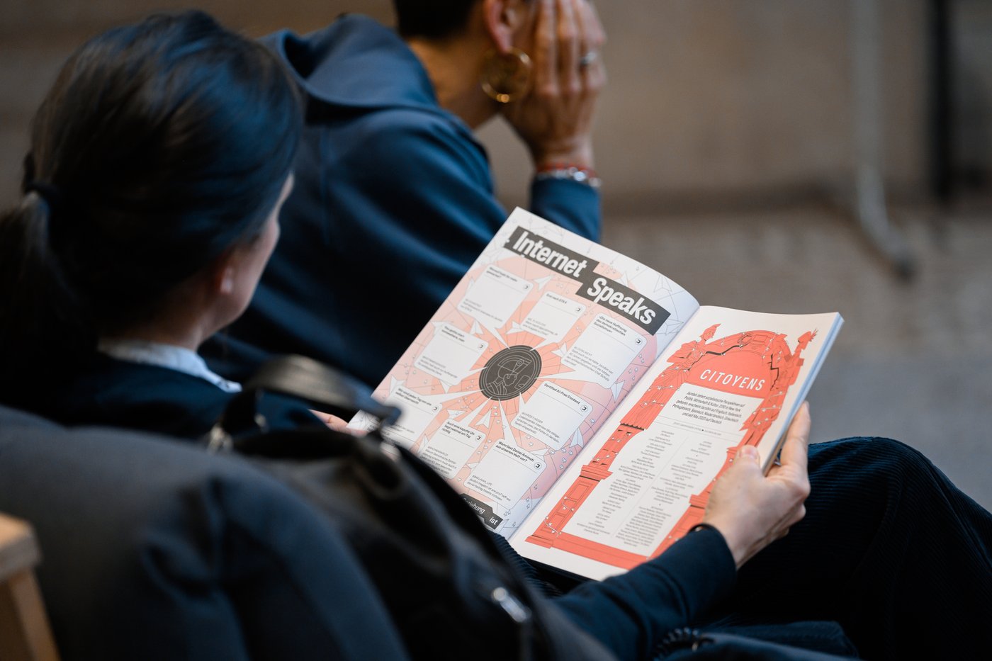 A woman reading Jacobin magazine