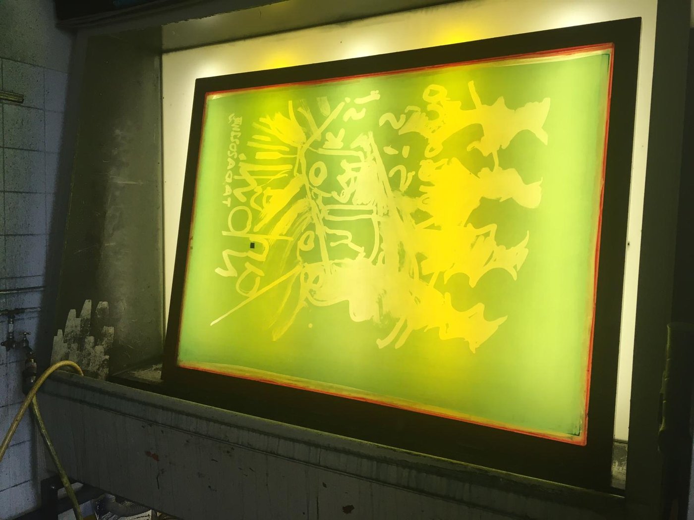 Frame with exposed screen in front of yellow light